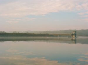 A photograph of haze and fog at the Lake Galena dam.
