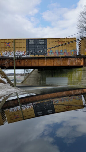 Video of a train reflecting off my roof.