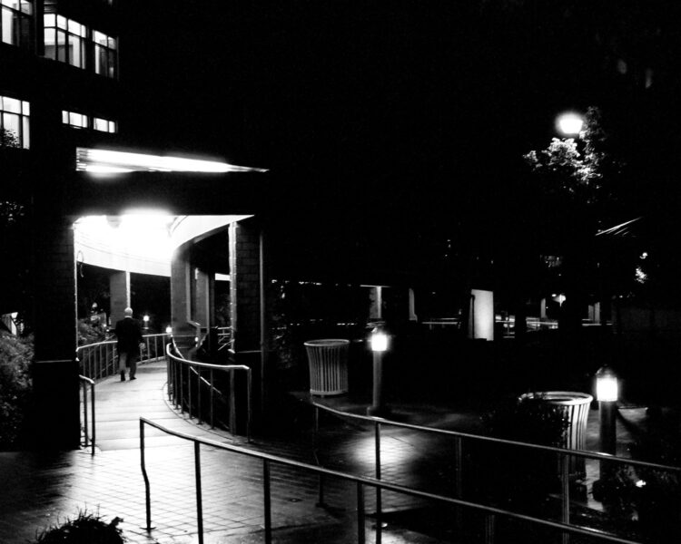 Man walking at night near Doylestown Courthouse