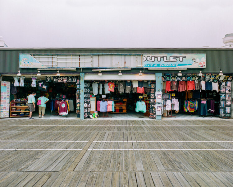 A broken sign on the boardwalk