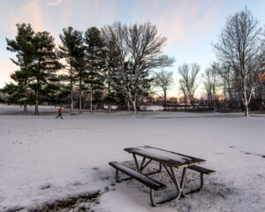 Photograph of a man running in red.