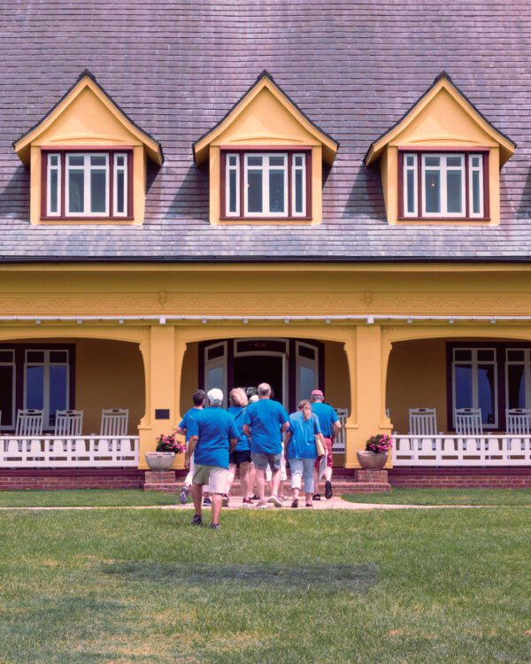 Blue people entering a yellow building, Whales Head, NC